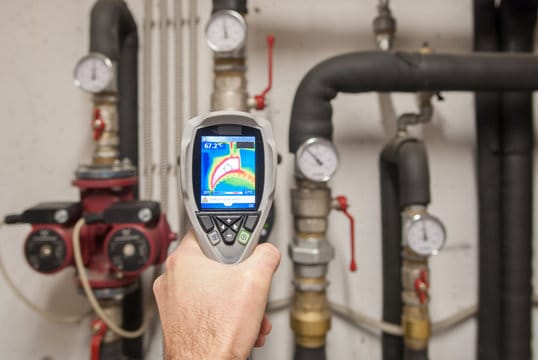 Plumber using a thermal imaging camera to inspect pipes in Lake Elsinore